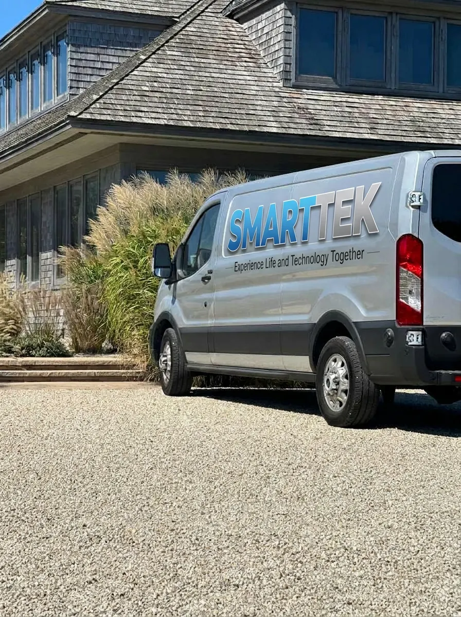 Smart Tek branded service truck outside a Long Island home